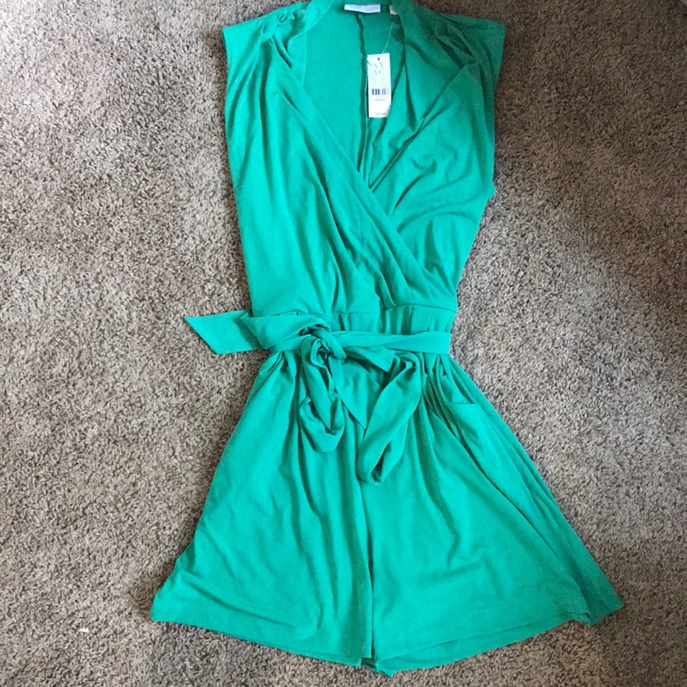 Green romper with belt and pockets